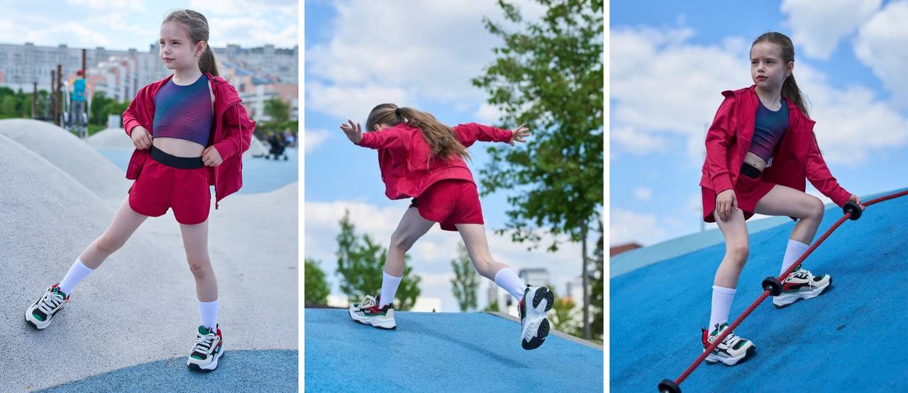 Девочка в спортивной одежде на спортивном поле.